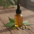 Pure neem oil in amber glass bottle with neem leaves
