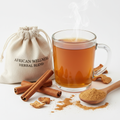 Cinnamon and Baobab Herbal Blend Tea in a glass mug with cinnamon sticks and baobab fruit