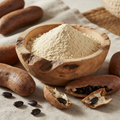Organic Baobab Powder in wooden bowl with baobab fruit